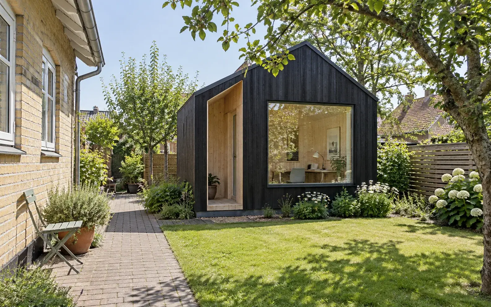 Concept of a gabled garden office in a Danish residential garden